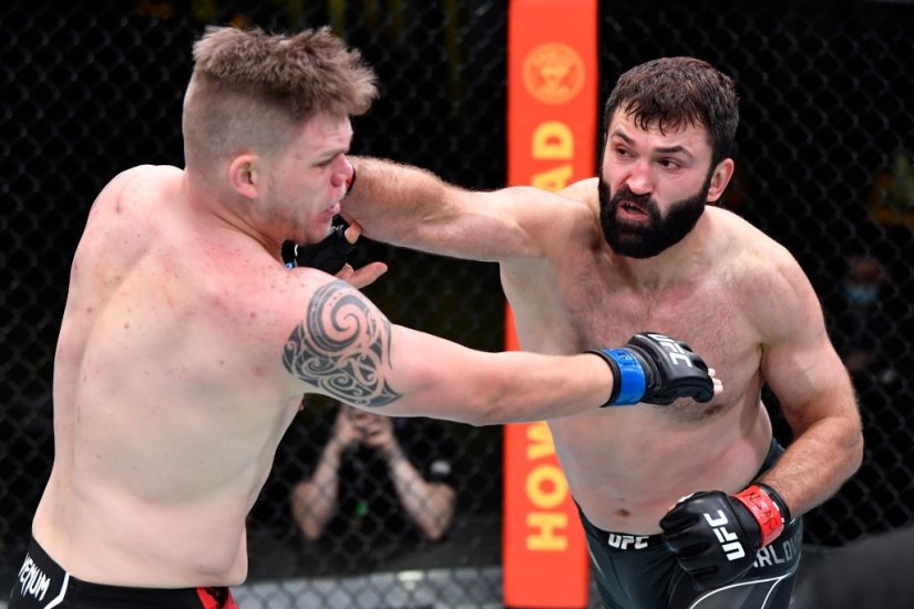 LAS VEGAS, NEVADA - APRIL 17: In this handout photo, (R-L) Andrei Arlovski of Belarus punches Chase Sherman in a heavyweight fight during the UFC Fight Night event at UFC APEX on April 17, 2021 in Las Vegas, Nevada. (Photo by Chris Unger/Zuffa LLC)