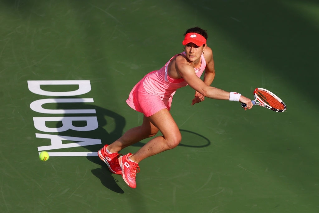 DUBAI, UNITED ARAB EMIRATES - MARCH 09: Alize Cornet of France stretches to play a backhand in her Round Two match against Aryna Sabalenka of Belarus during Day Three of the Dubai Duty Free Tennis Championships at Dubai Duty Free Tennis Stadium on March 09, 2021 in Dubai, United Arab Emirates. (Photo by Francois Nel/Getty Images)