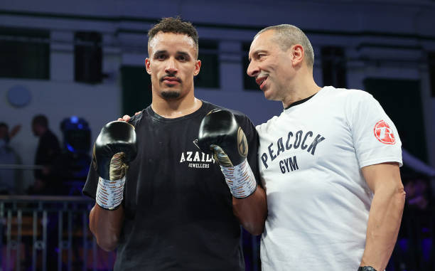 LONDON, ENGLAND - NOVEMBER 12: Ellis Zorro speaks to his trainer Martin Bowers after the Cruiserweight fight between Ellis Zorro and Tomislav Rudan at York Hall on November 12, 2021 in London, England. (Photo by James Chance/Getty Images)