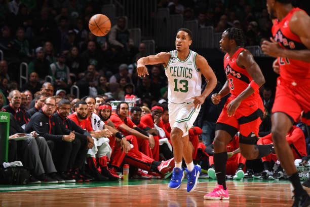 BOSTON, MA - OCTOBER 5: Malcolm Brogdon #13 of the Boston Celtics passes the ball during the game against the Toronto Raptors on October 5, 2022 at the TD Garden in Boston, Massachusetts. NOTE TO USER: User expressly acknowledges and agrees that, by downloading and or using this photograph, User is consenting to the terms and conditions of the Getty Images License Agreement. Mandatory Copyright Notice: Copyright 2022 NBAE (Photo by Brian Babineau/NBAE via Getty Images)