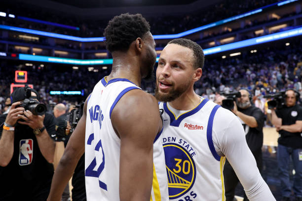 SACRAMENTO, CALIFORNIA - APRIL 26: Stephen Curry #3 and Andrew Wiggins #22 of the Golden State Warriors celebrate after they beat the Sacramento Kings in Game Five of the Western Conference First Round Playoffs at Golden 1 Center on April 26, 2023 in Sacramento, California. NOTE TO USER: User expressly acknowledges and agrees that, by downloading and or using this photograph, User is consenting to the terms and conditions of the Getty Images License Agreement. (Photo by Ezra Shaw/Getty Images)