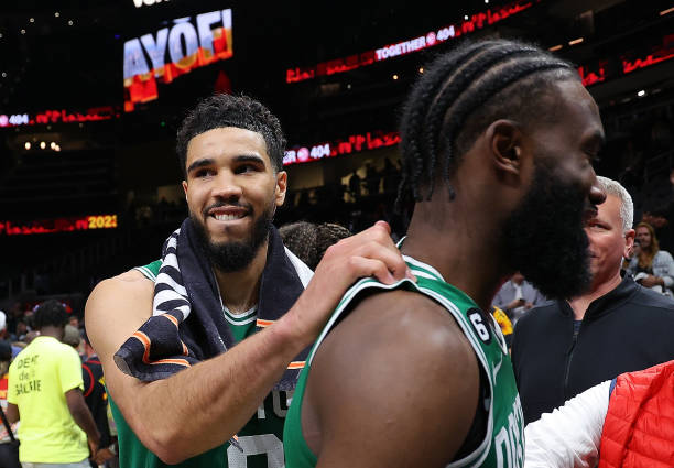 ATLANTA, GEORGIA - APRIL 27: Jayson Tatum #0 of the Boston Celtics celebrates their 128-120 win over the Atlanta Hawks with Jaylen Brown #7 after Game Six of the Eastern Conference First Round Playoffs at State Farm Arena on April 27, 2023 in Atlanta, Georgia. NOTE TO USER: User expressly acknowledges and agrees that, by downloading and or using this photograph, User is consenting to the terms and conditions of the Getty Images License Agreement. (Photo by Kevin C. Cox/Getty Images)